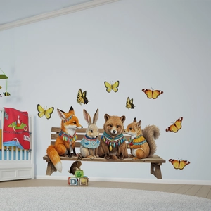 Detail of forest animal wall decals featuring a fox, rabbit, bear, and squirrel on a bench