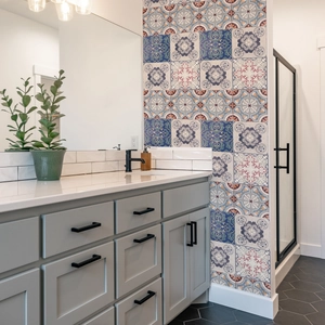 Retro geometric marble pattern wall tile stickers in navy blue and pink for bathroom decor