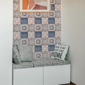 Detail of vintage mosaic tile stickers with blue and brown geometric floral patterns