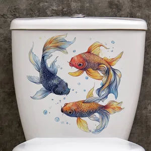 Detail of colorful koi fish wall stickers on white toilet tank with water bubbles decoration