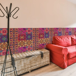 Close-up of vintage mandala tile stickers on a home wall with colorful bohemian patterns