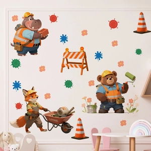 Detail of construction-themed cartoon animal wall stickers on a white nursery wall