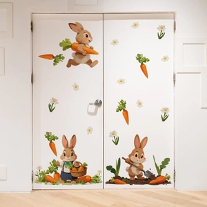 Detail view of cute cartoon bunny and carrot wall decals on a white bedroom door decor