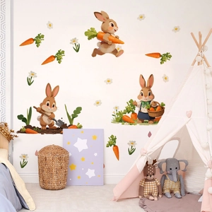 Detail of cartoon bunny and carrot wall stickers in a cozy child's bedroom setting