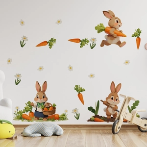 Detailed view of hand-drawn cartoon rabbit and carrot wall stickers in a nursery setup
