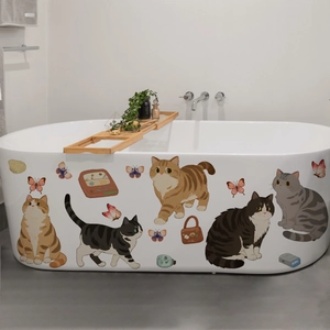 Cartoon cats and butterflies waterproof stickers applied on a white bathtub side