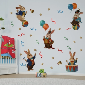 Detail of vintage circus rabbit wall stickers in a cozy nursery with a wooden crib