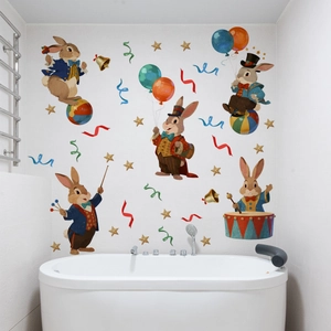 Detailed view of circus rabbits and stars wall stickers applied on white bathroom tiles
