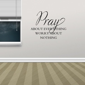 Detail of Pray About Everything vinyl wall decal on a white surface with crisp black text
