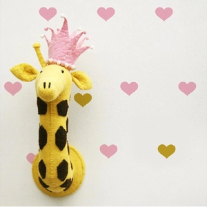 Plush giraffe wall hanging with crown and heart decals for nursery room decoration