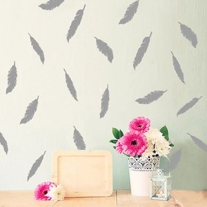 Dark grey feather wall stickers set in a creative and modern home bedroom decor arrangement