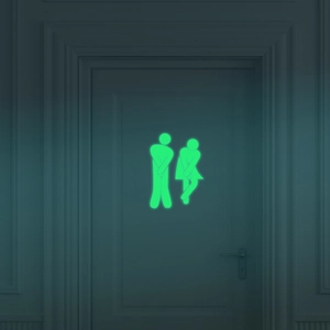 Luminous toilet door sticker featuring glowing male and female figures in a dark setting