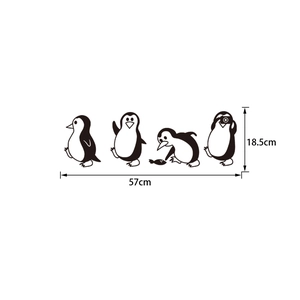 Detail showing four cute cartoon penguin wall stickers with dimensions 57cm by 18.5cm