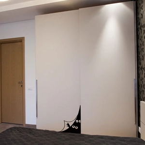Sticker mural créatif yeux de monstre pour décoration DIY sur porte de placard blanche
