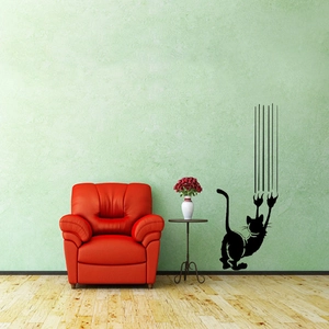 Niedliches Katzen-Silhouette Wandtattoo mit Kratzspuren an einer grünen Wand