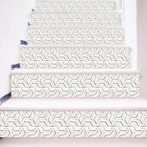 Detail of white stair stickers with golden geometric patterns for home renovation