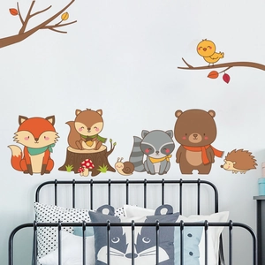 Detail of forest animal wall stickers featuring fox and bear in a kids nursery setting