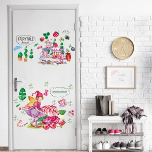 Detail view of fairytale fairy and watercolor dessert wall stickers on a white wooden door
