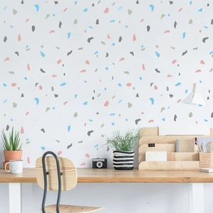 Detail of multi-color terrazzo pattern wall sticker in a modern minimalist office scene