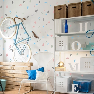 Detail of colorful terrazzo geometric wall stickers in a modern home decor setting