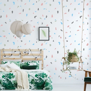 Detail of colorful terrazzo wall stickers in a modern bedroom with Nordic design