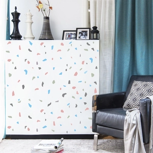 Detail of colorful terrazzo vinyl sticker applied on white minimalist kitchen cabinets