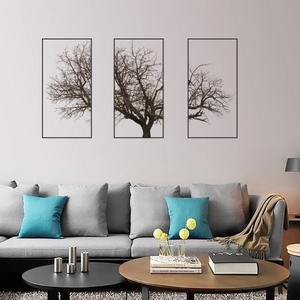Detail of Nordic grey tree triptych wall art decor in a modern living room setting