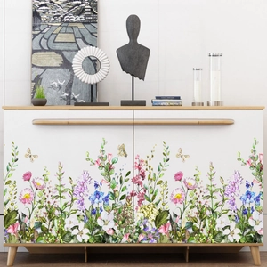 Wildflower floral wall stickers for white cabinet decoration in a modern living room setting