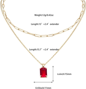 Detail of gold layered chain necklace showing red gemstone pendant size 15mm by 11mm