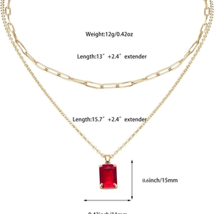 Gold layered necklace set with paperclip chain and rectangular red zircon pendant