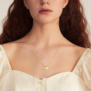 Gold 18K plated stainless steel necklace with round M letter pendant and tiny heart