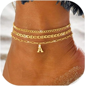 Detailed view of triple-layered golden anklet with cuban chain and initial A charm