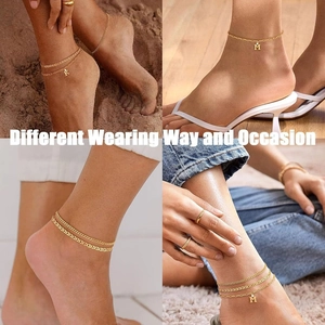 Golden double layer anklet with initial charms in Cuban and snake chain styles