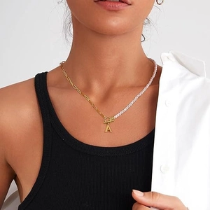 Half pearl and gold paperclip chain necklace with initial A pendant and T-bar clasp