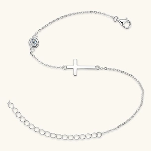 Minimalist silver chain bracelet featuring a horizontal cross and a sparkling zircon stone