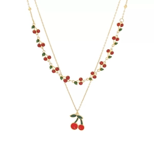 Double-layered golden anklet set featuring vibrant red cherry charms with green leaves