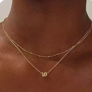 Double-layered gold letter W pendant necklace with ball chain and cross chain for women