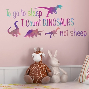 Close-up of colorful watercolor dinosaur wall sticker with To go to sleep quote for kids
