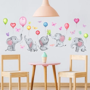 Detail showing watercolor cartoon elephants and colorful balloons wall stickers in nursery