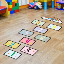 Detail showing colorful hopscotch numbers floor stickers for children's playroom