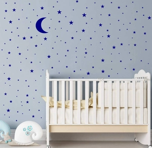 Blue moon and stars wall stickers for DIY nursery decor on a smooth blue wall