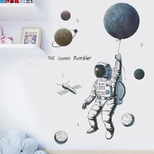 Detailed view of cosmic explorer wall stickers with astronauts and planets in a nursery