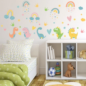 Detailed view of colorful dinosaur and rainbow wall stickers in a cozy child's bedroom