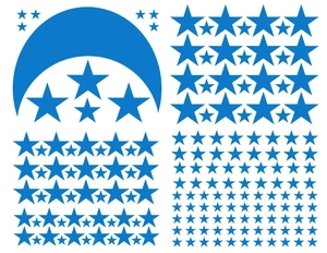 Detailed view of various sizes of blue star and moon wall stickers on white background
