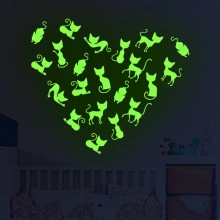 Luminous glow-in-the-dark cat silhouette wall stickers arranged in a large heart shape