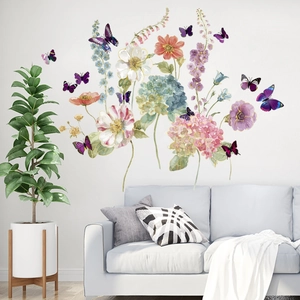 Watercolor flower and butterfly wall stickers for living room decor over a blue sofa