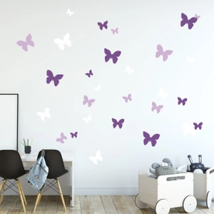 Detailed view of colorful butterfly wall stickers in a cozy nursery room setting