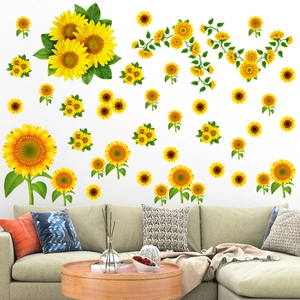 Detail of sunflower wall stickers set with vibrant yellow petals and green leaves