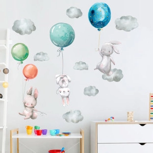 Nursery wall decals featuring watercolor rabbits, colorful hot air balloons and clouds