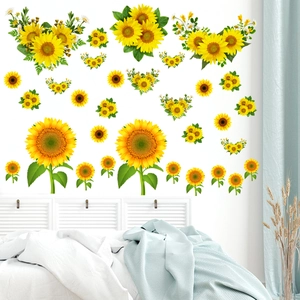 Detail of sunflower wall stickers with vibrant yellow petals on a clean white bedroom wall